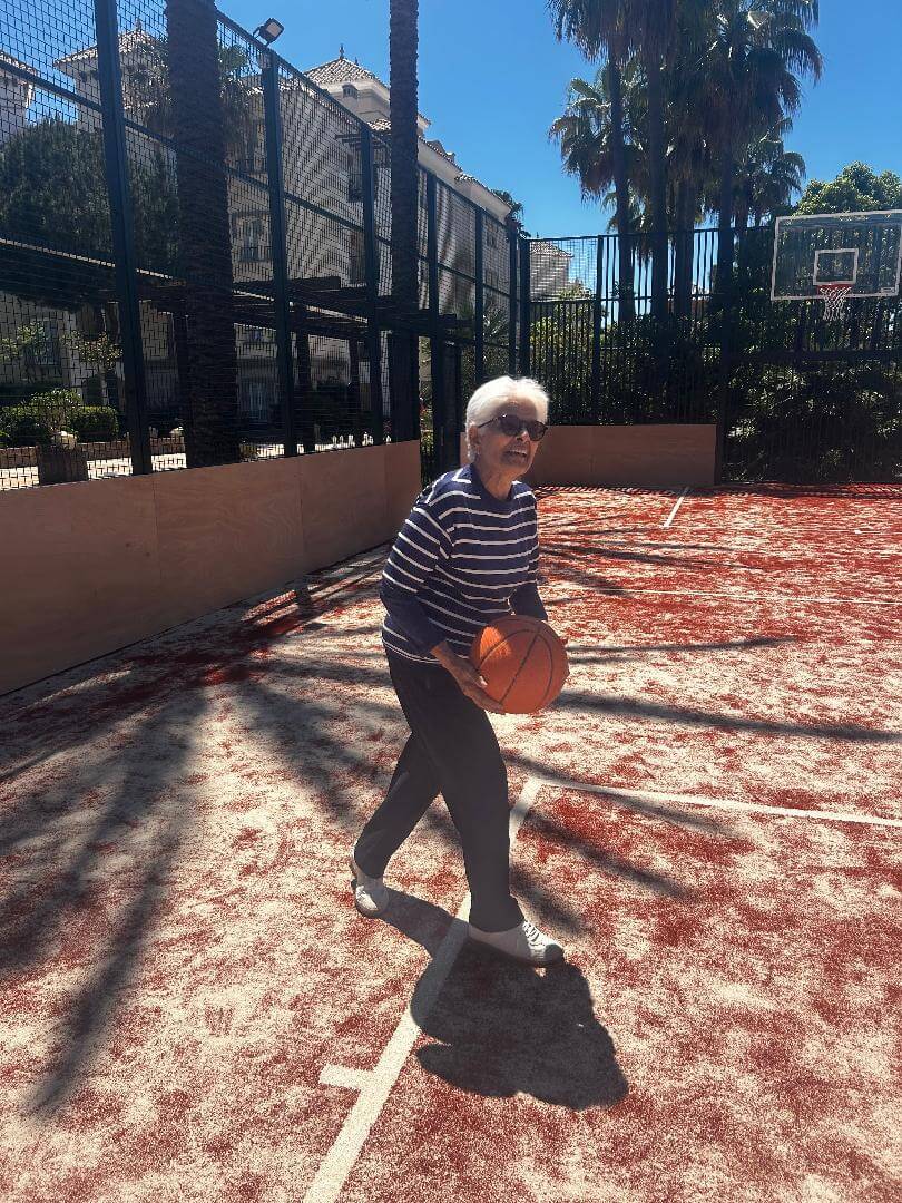 Older person playing basketball